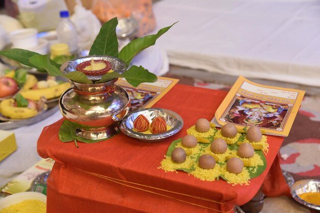 navgrah-pooja-traditional-indian-wedding-ceremony-items-pooja-kalash-diya-betel-nuts_762094-136